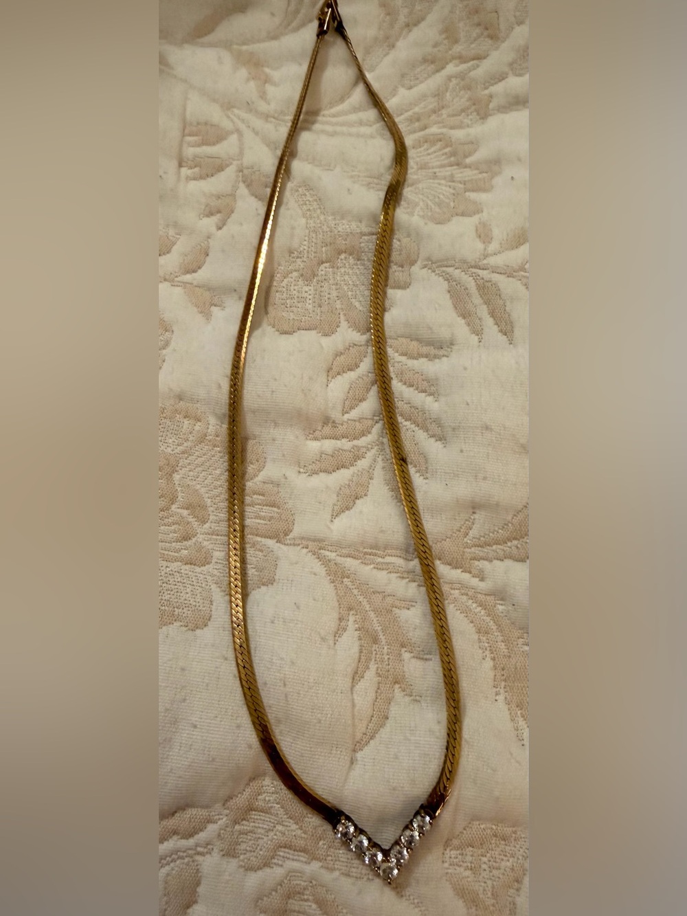 Gold tone Herringbone Chain Necklace with diamond like stones